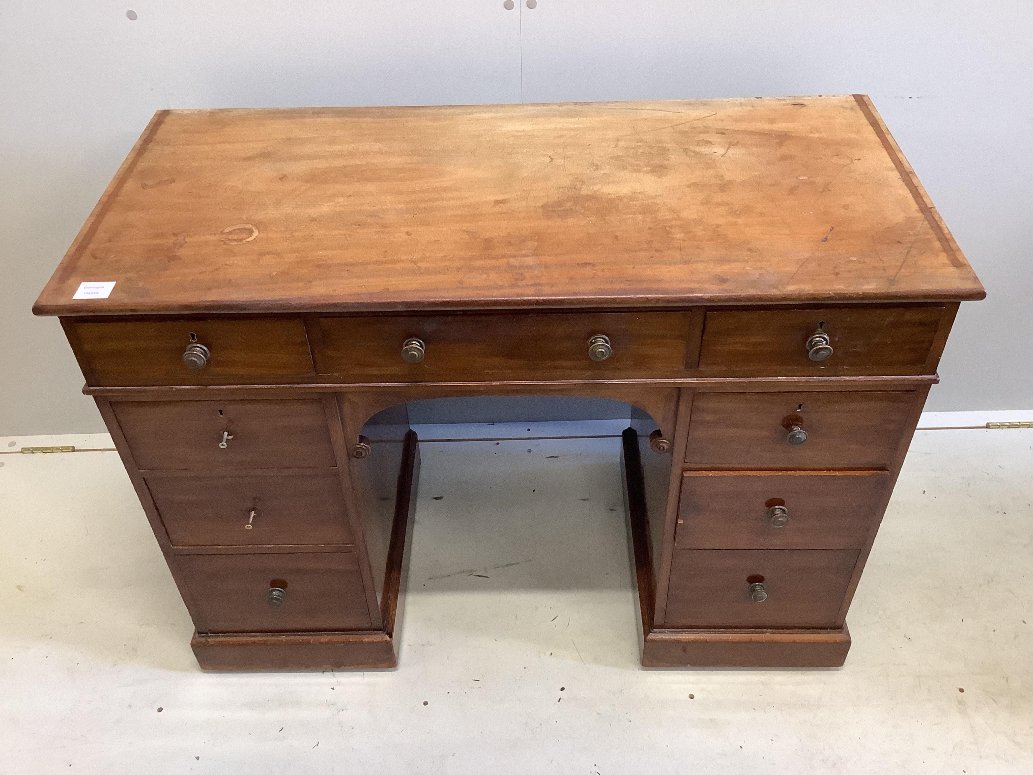 A Victorian mahogany kneehole dressing table, fitted nine small drawers, width 107cm, depth 49cm, height 78cm. Condition - poor to fair